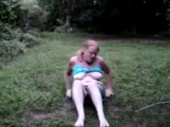 My plump redhead girlfriend is having a crazy time masturbating outside in the garden.